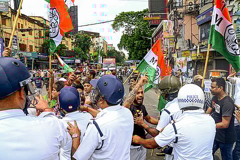 BJP's Bengal Bandh: Police personnel try to stop TMC workers from engaging in a clash with BJP supporters in Kolkata